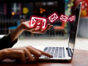 women holding envelope of spam email