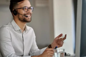 male customer service representative talking white shirt