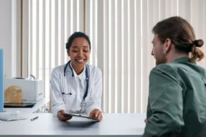 doctor in white coat talking to patient