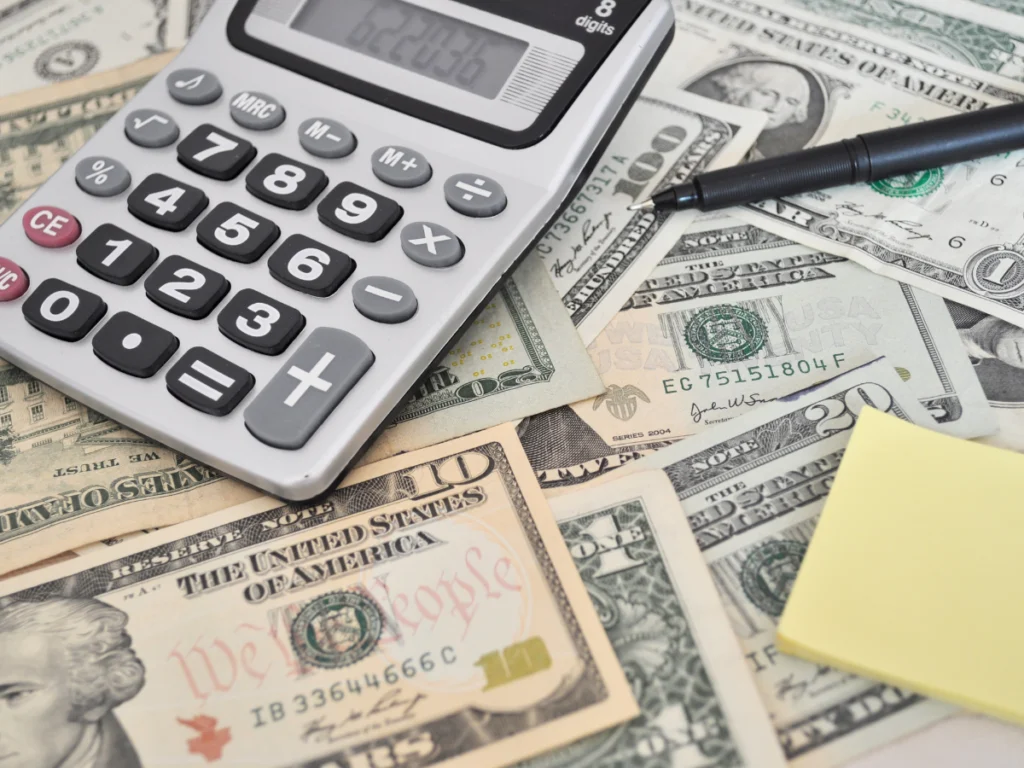 a calculator and money on the table