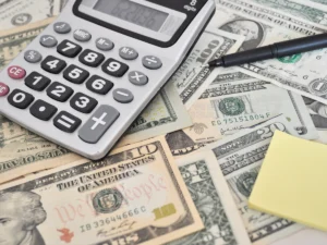 a calculator and money on the table