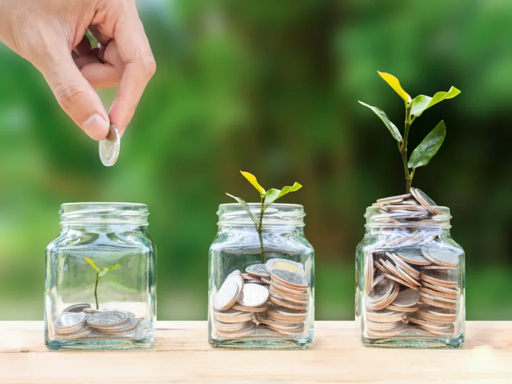 coins in 3 jars symbolizing financial success in business