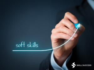 a man writing the words "soft skills" with an arrow going up symbolizing career growth