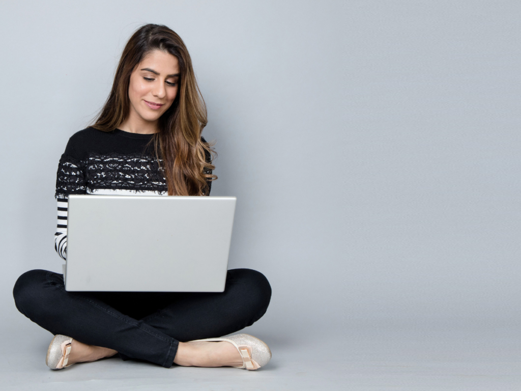 A woman taking self-development course on her laptop.