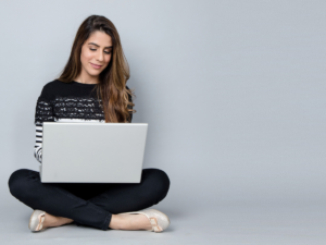 A woman taking self-development course on her laptop.