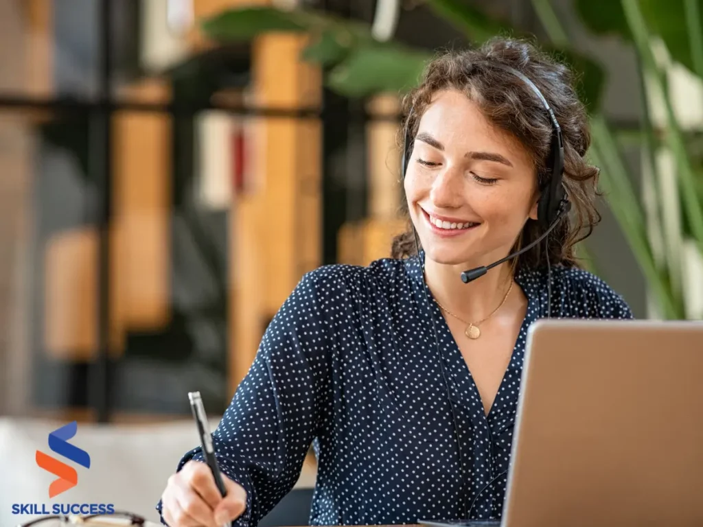 A woman with strong client relationship management skills writing notes.