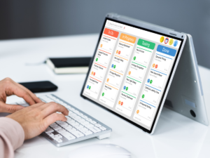 a photo of a tablet with kanban project management tool used for project outline