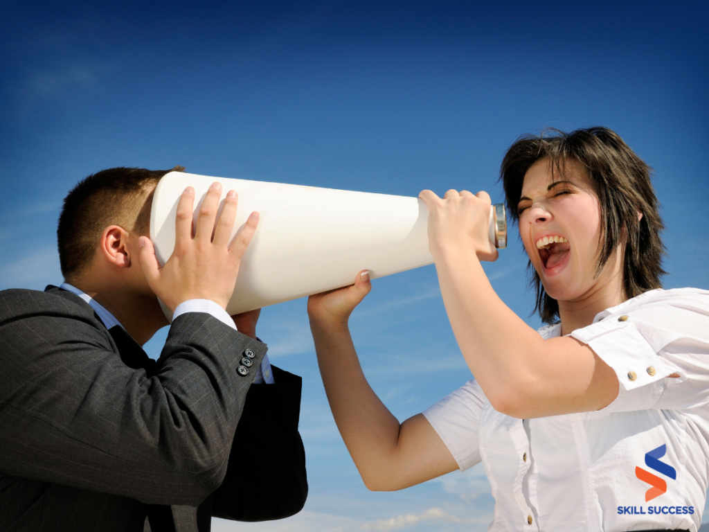 a woman shouting at a businessman using a megaphone
