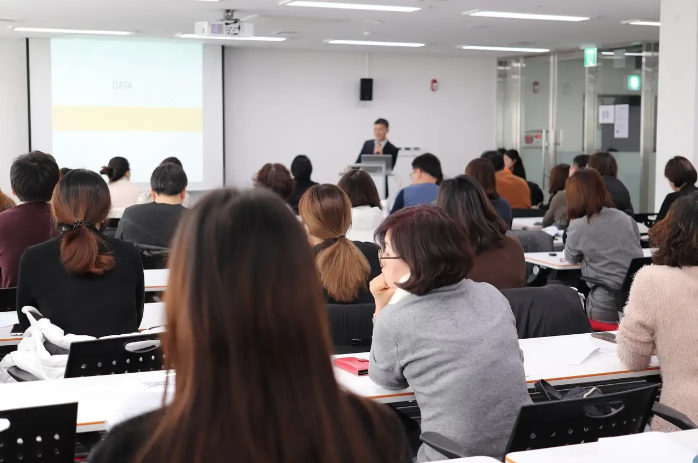 teacher in a room full of college students