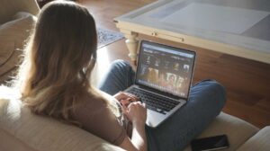 learner watching an online science course on laptop