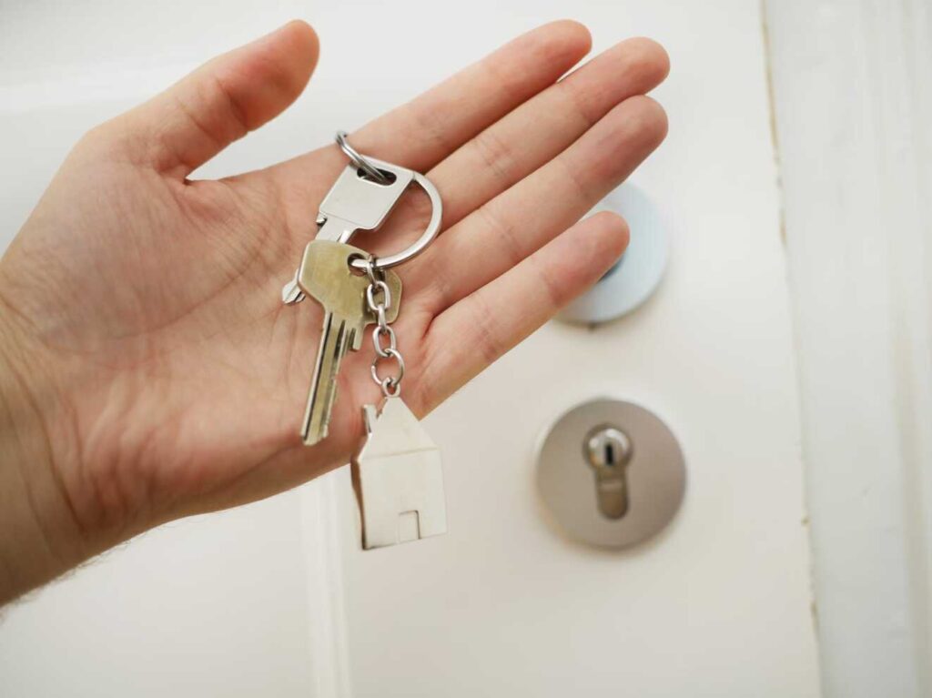 hand holding house keys