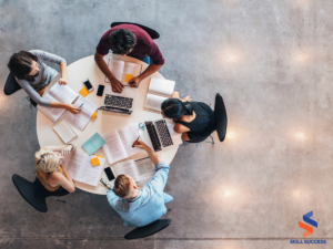 a group of students in a round table deciding whether to choose bootcamp or degree