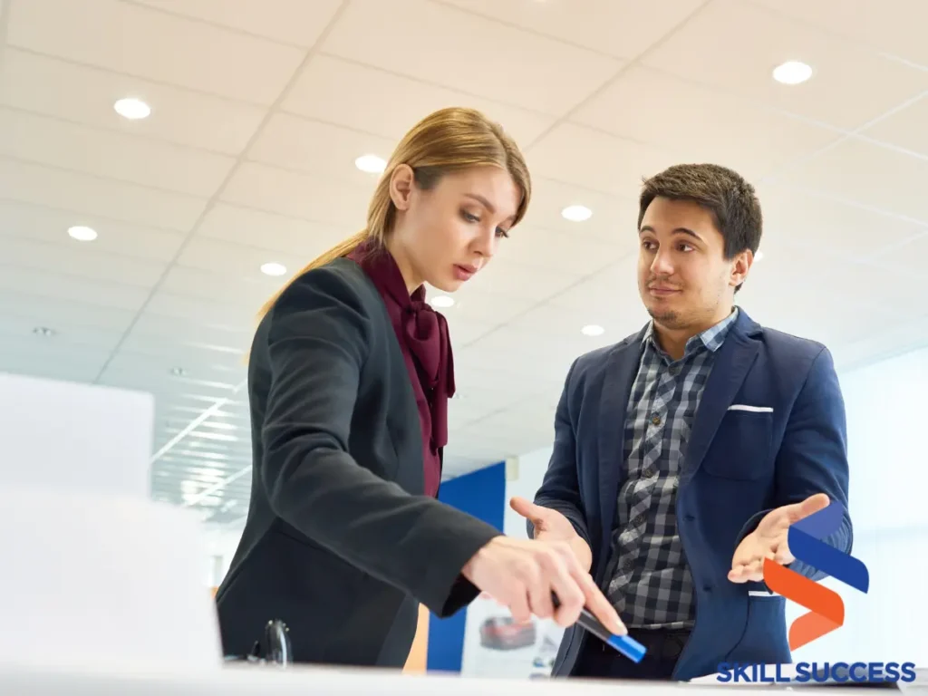 Office setting with a man and woman, showing various conflict stages through their body language.