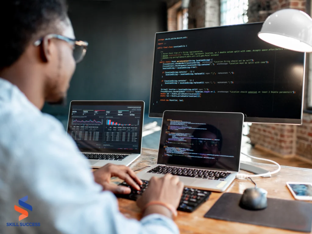 a man using a computer on highest paid programming language