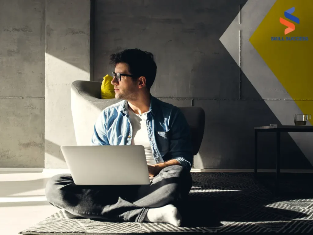 a young freelancer working from home with his laptop