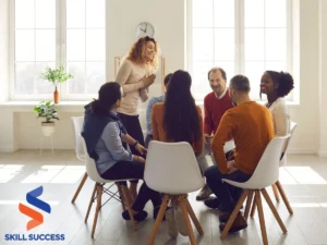 People collaborating at a table, exchanging microlearning strategies to enhance organizational effectiveness in a meeting room.