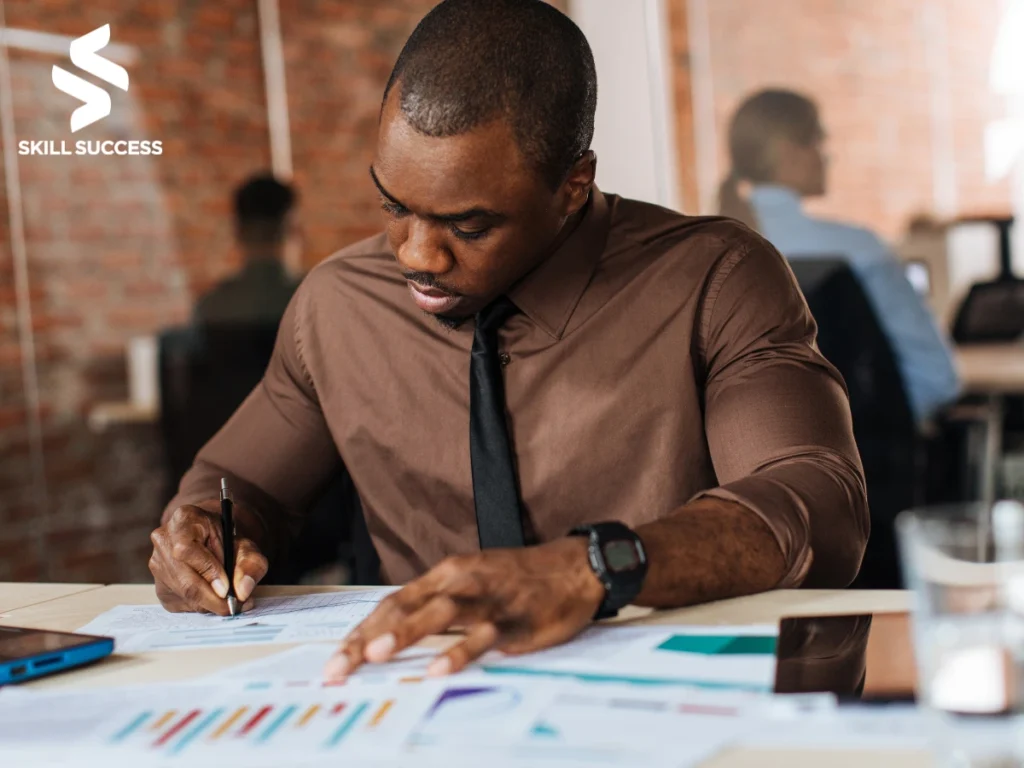 A man working on different tasks after taking the best online course for productivity