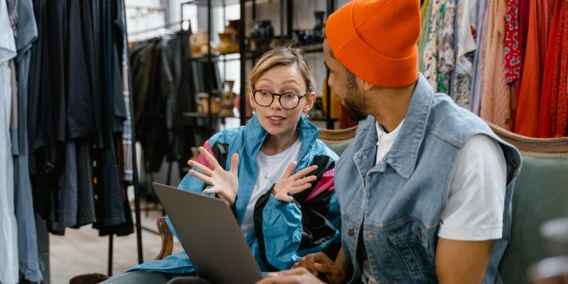 excited amazon merchant looking at laptop