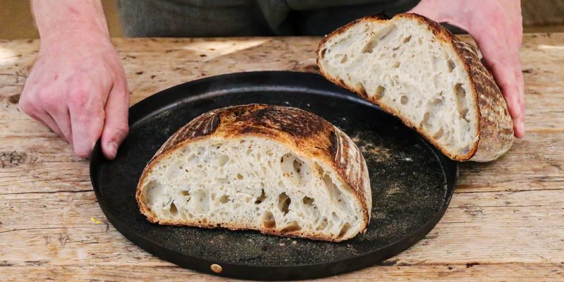 overnight sourdough bread on plate baker with sourdough bread on plate
