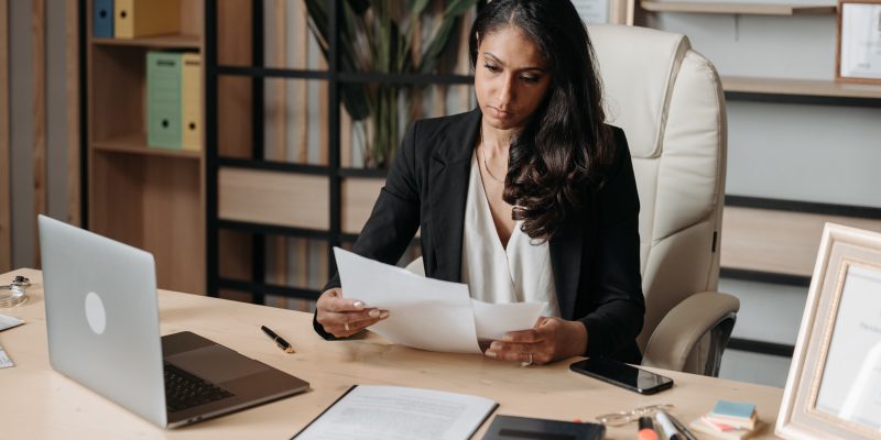 woman considering career change middle age career woman looking at files