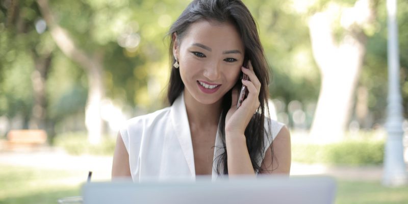 job seeker in white blazer smiling