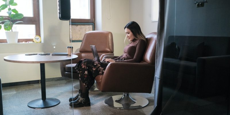 woman writing header for resume professional woman using laptop to type resume