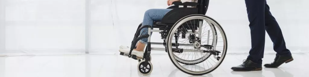 occupational-therapist-assisting-woman-on-a-wheelchair