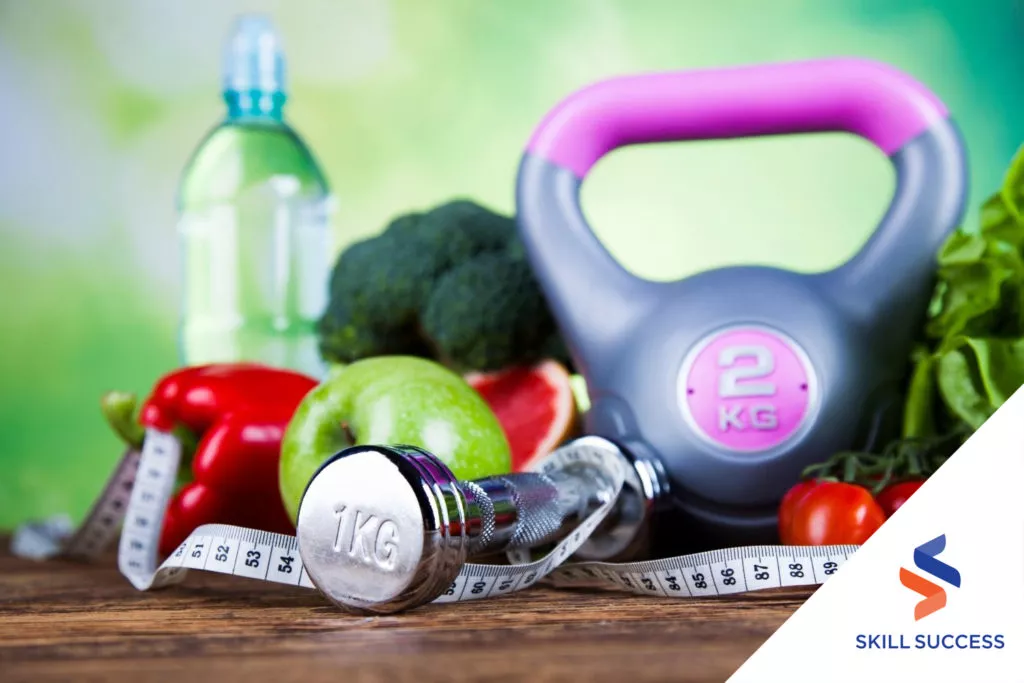 home-health-aides-kettlebelll-dumbbell-fruits-vegetables-and-bottle-of-water