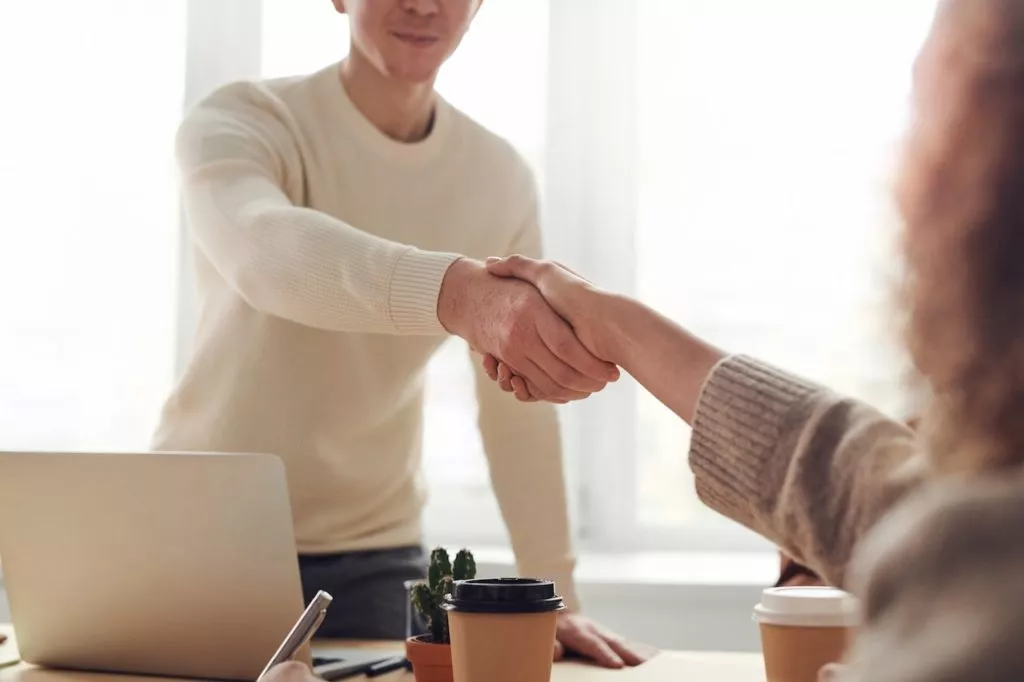 competency based interview shaking hands