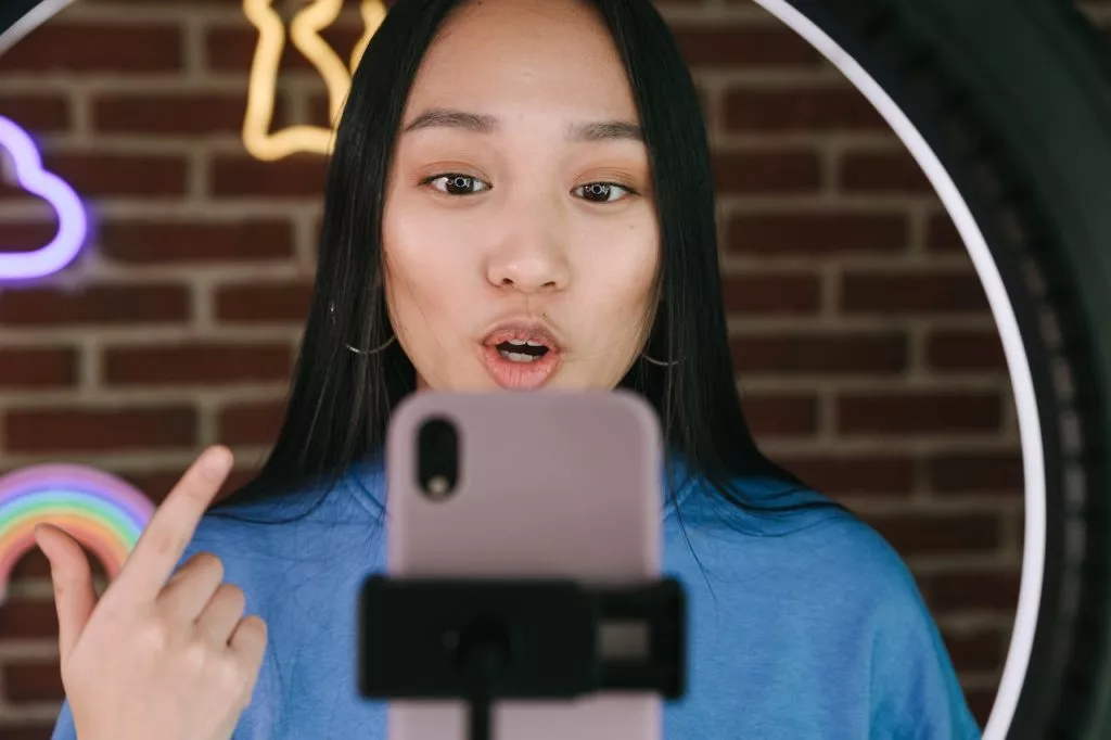 youtube influencer recording video with iphone