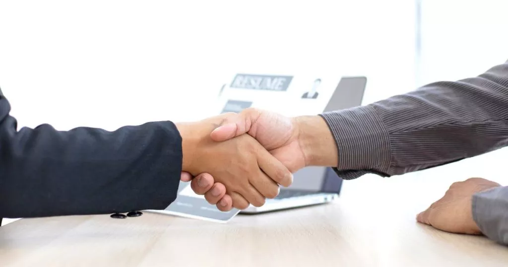 Signs you will get the job after interview shaking hands