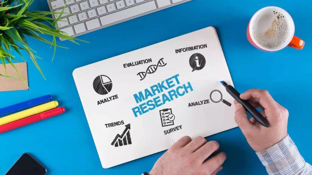 How to Conduct Market Research Hand Writing on Paper