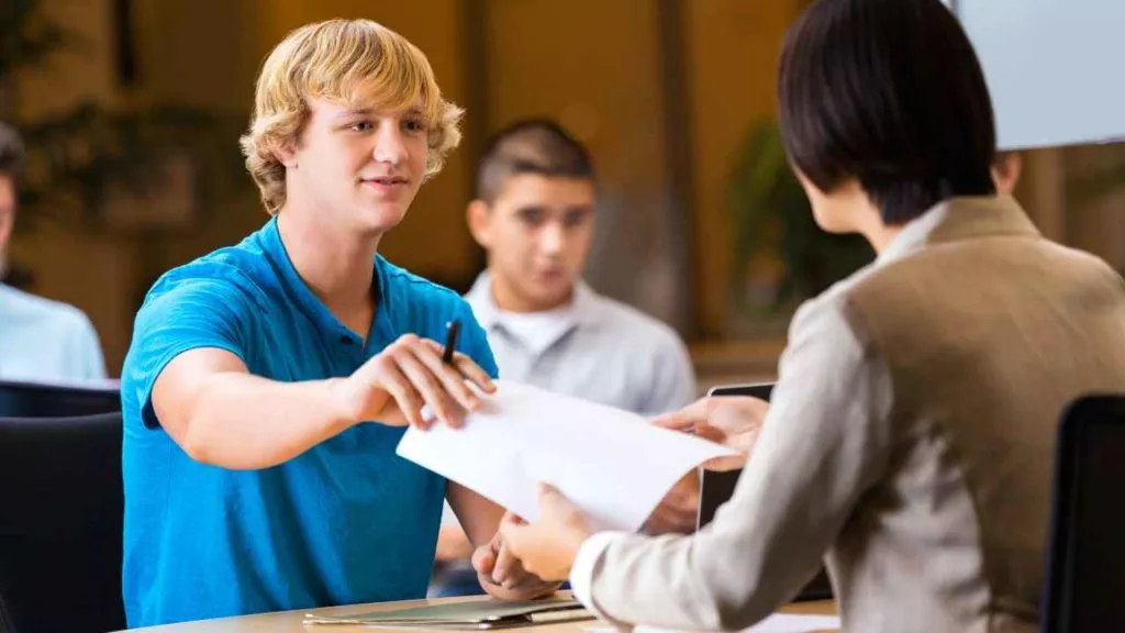 Successful Job Search College Student Handing Application to Recruiter