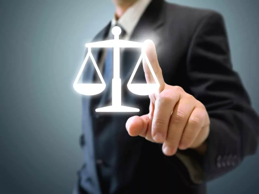 criminal law pointing at balance scales