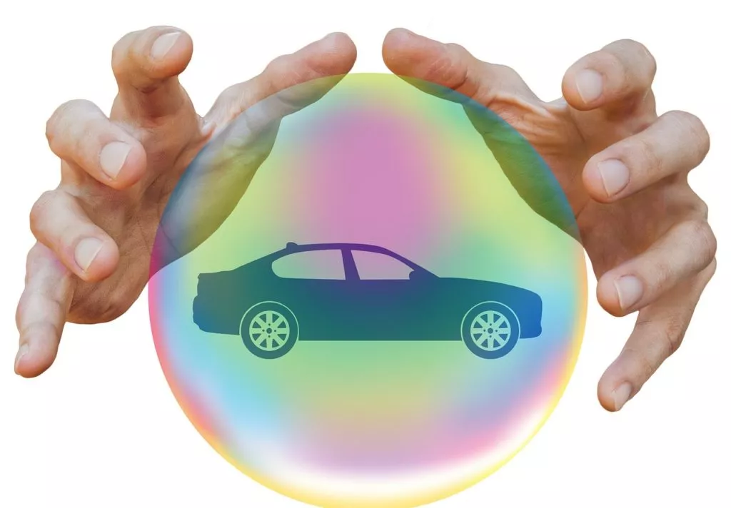 Insurance rates hands car crystal ball