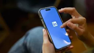 linkedin ads campaigns person using linkedin on mobile