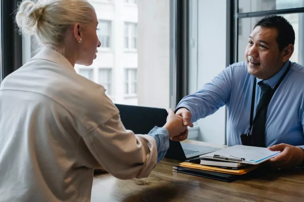 Applicant shaking recruiter hand