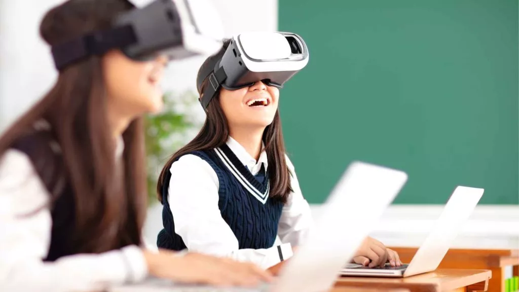 virtual classroom students using virtual reality gear and laptop
