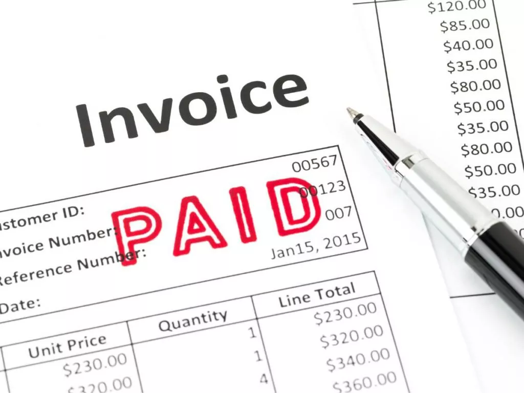 invoice and pen with paid stamp (1)