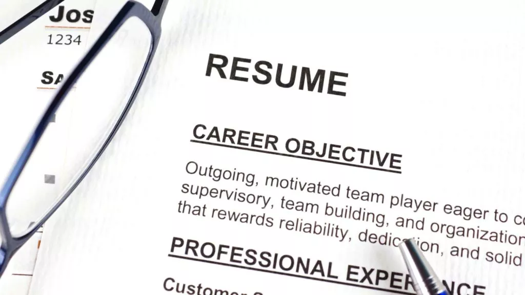 resume glasses on top career objective close up