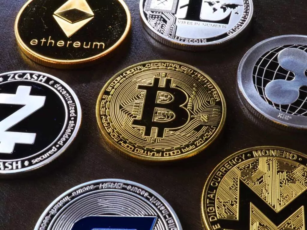various cryptocurrency coins on table
