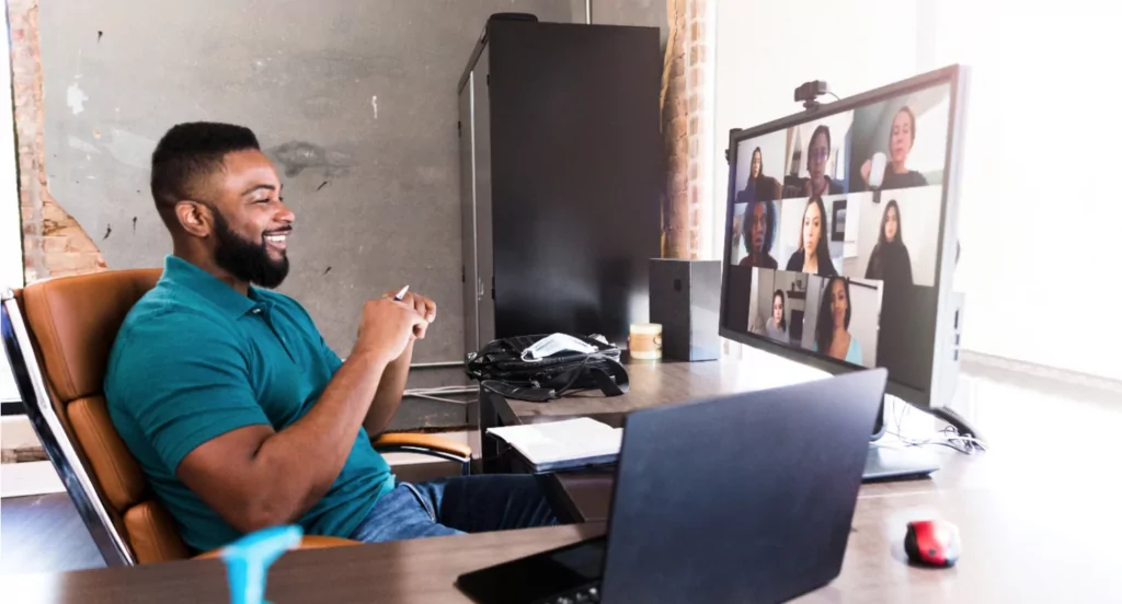 Man Working From Home Having Virtual Conference with Remote Team
