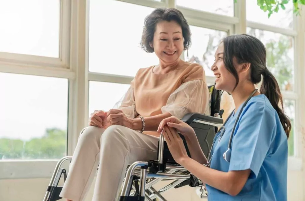 family nurse practitioner fnp taking care of elderly woman on wheelchair