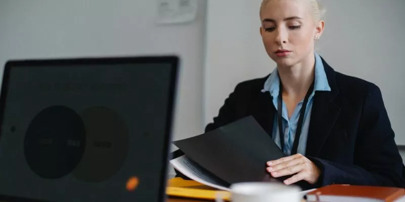 female executive assistant working at table in office