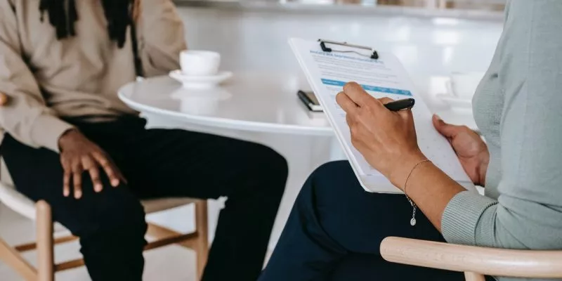 interviewer and job seeker going through interview