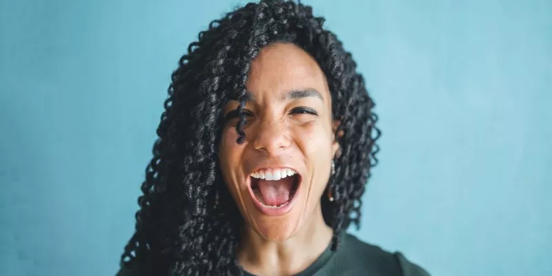 woman in knitted shirt screaming