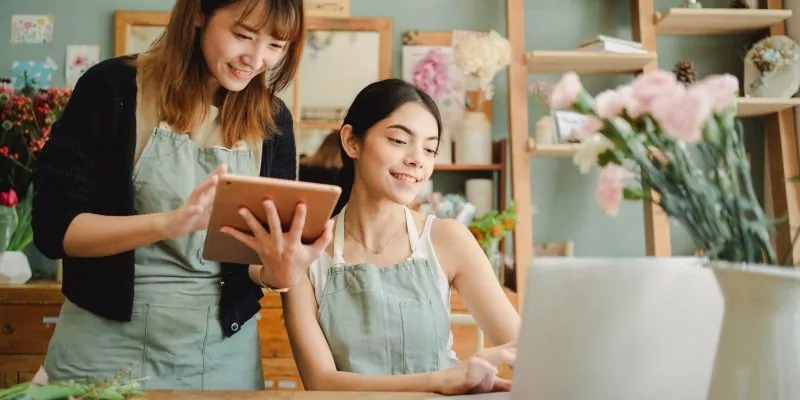 two women working in floral store